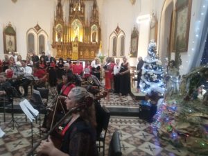 Voces y música llenaron el Templo del Carmen en el Concierto de Navidad